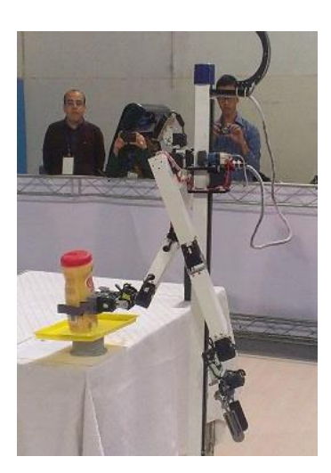 Fig. 3. Object recognition and grasping during the AUTRoboCup 2013 in Iran