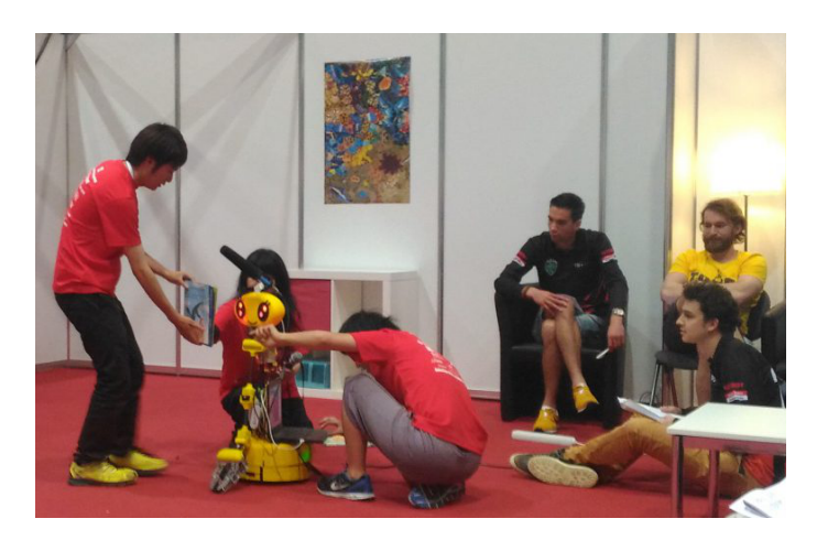 Fig. 3. Picture book reading demo in RoboCup2016