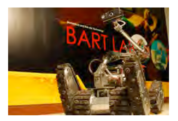 The TeleOpIII, one of our two tele-operative robots in BART LAB Rescue team. The TeleOpIII employs tracked locomotion system with 4 independent flippers, and equips with an inverse-kinematically controlled manipulator to enhance more ability to search and retrieve better victim information, similar to other robots in [1,2].