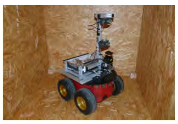 (a) Our Pioneer 3 AT based robot Robbie. (b) User interface of the operator station.
