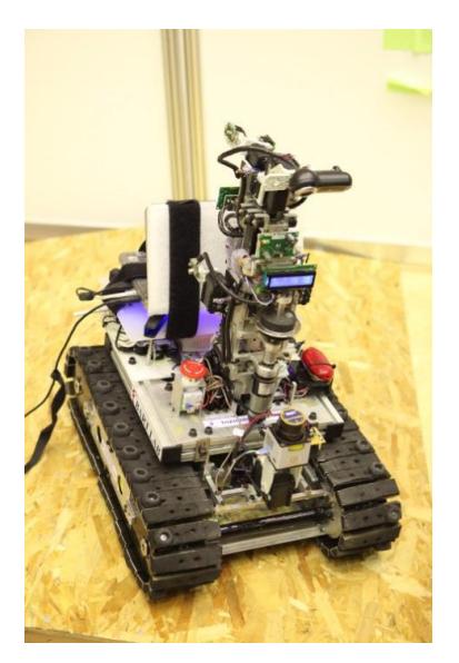 Fig. 2. The Autonomous robot, AutoBotII, is track-based locomotion system with victim identification sensing system based on image processing and heat imaging technology