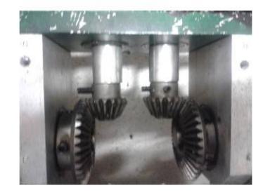 Second stage of reduction with bevel gears.