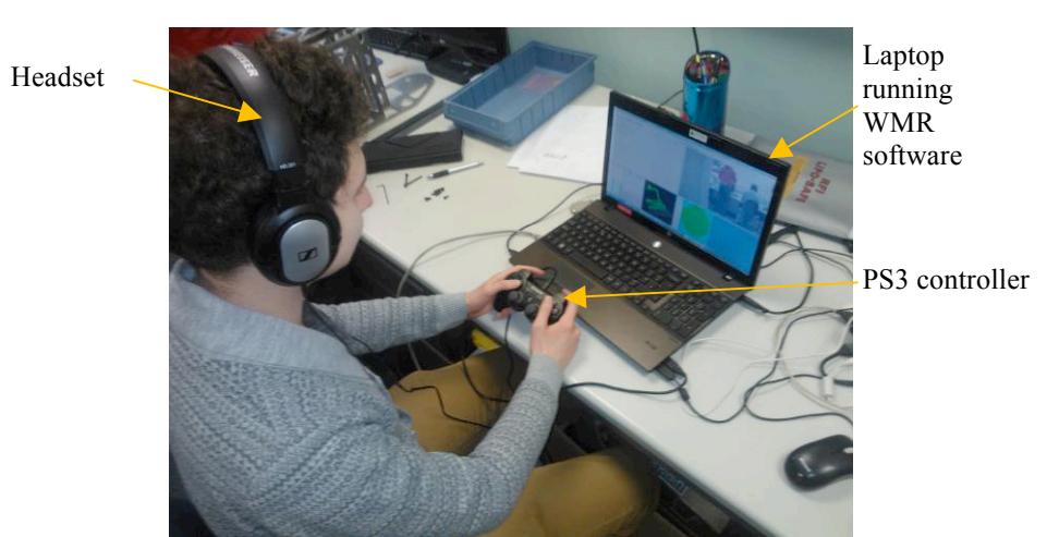 Fig. 1. Operator station being used to control the WMR robot.