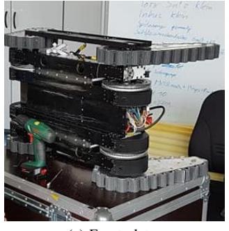 Fig. 5. Track guide. Image shows the front plates and the bottom plate with integrated active cooling
