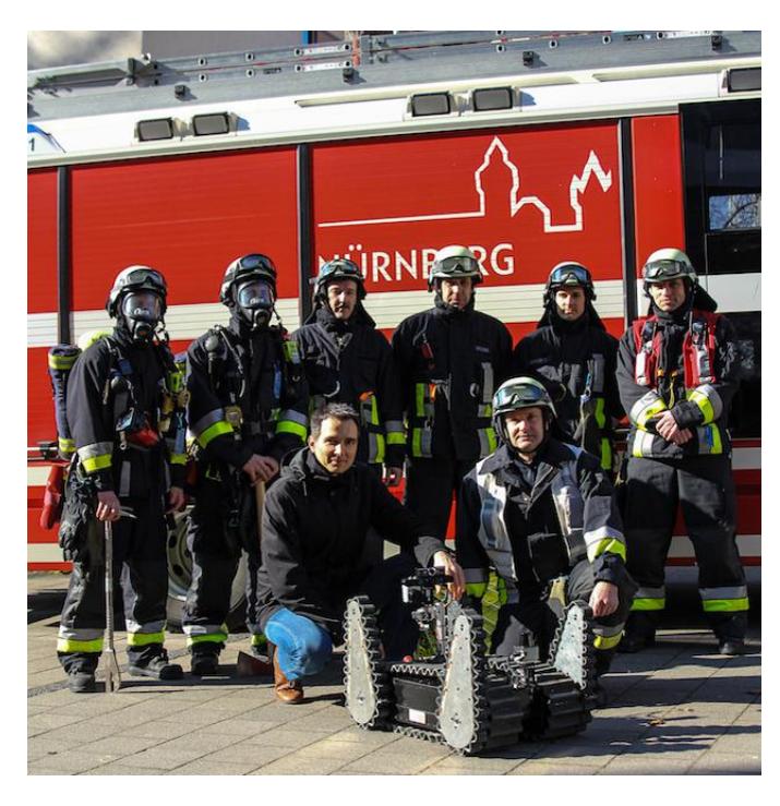 Fig. 12. Robot Schroedi and the fire brigade of Nuremberg.