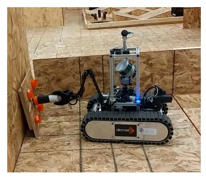 Fig. 2: The Jasmine robot performing a manipulation task.