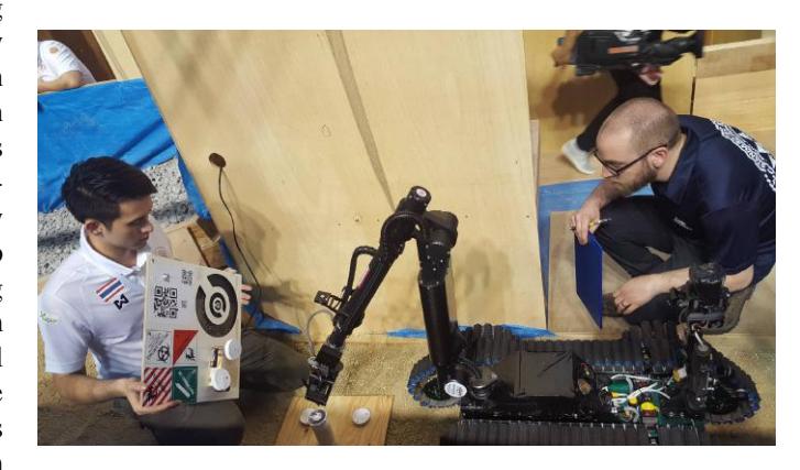 Fig. 4. The robot manipulator arm has a camera and a gripper at the end effector for the readiness test.