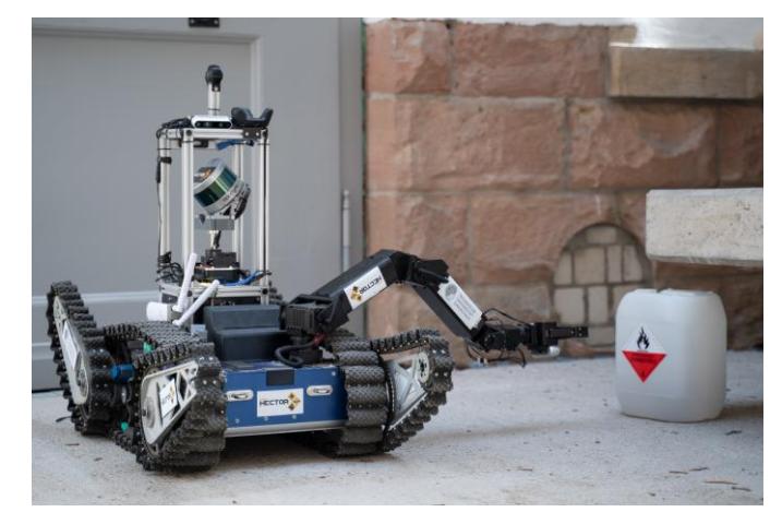 Fig. 1: Asterix rescue robot performing a visual inspection task.