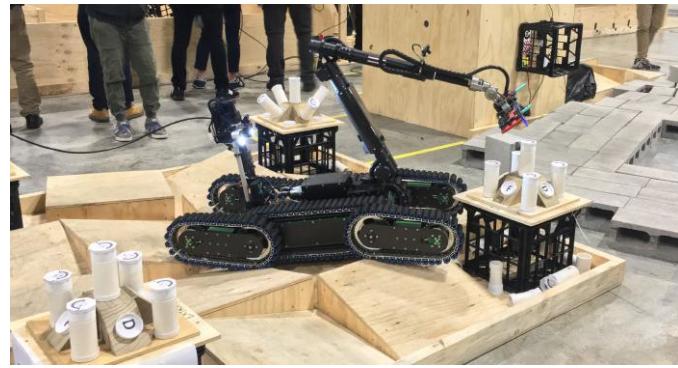 Fig. 4. The robot manipulator arm has a camera and a gripper at the end effector for the readiness test.