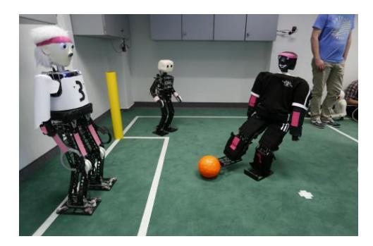 Fig. 1. Left: Previously built TeenSize robots. Right: Team NimbRo TeenSize during RoboCup 2016 in Leipzig, Germany.