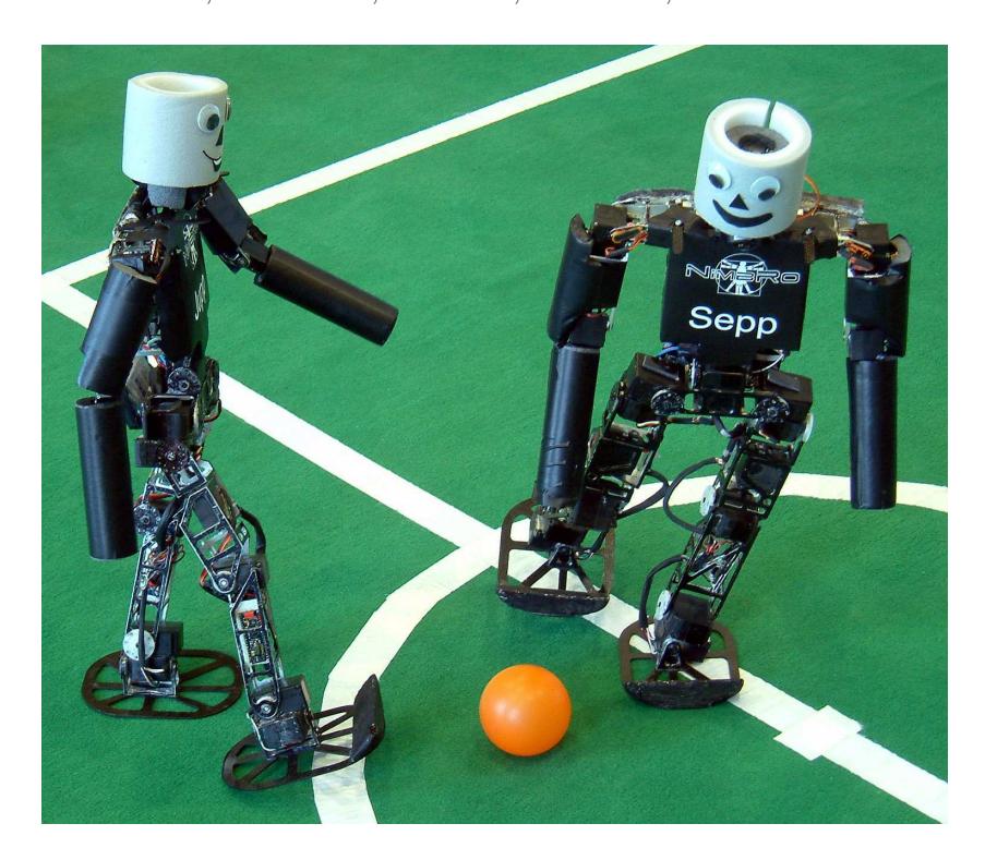 Fig. 1. NimbRo KidSize robots Jupp and Sepp playing soccer.