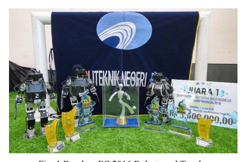 Fig. 1 BarelangFC 2016 Robots and Trophy