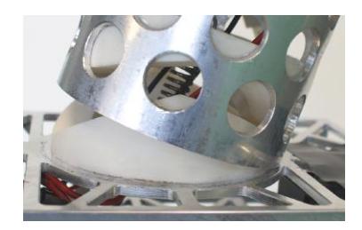 Mechanical details of Copedo: overload protection in the hip with preloaded spring (left); parallel leg kinematics with knee spring (right).