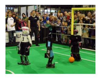 Left: Team NimbRo with robots Dynaped, Copedo, and NimbRo-OP. Right: Team NimbRo vs. CIT-Brains in the RoboCup 2013 finals.