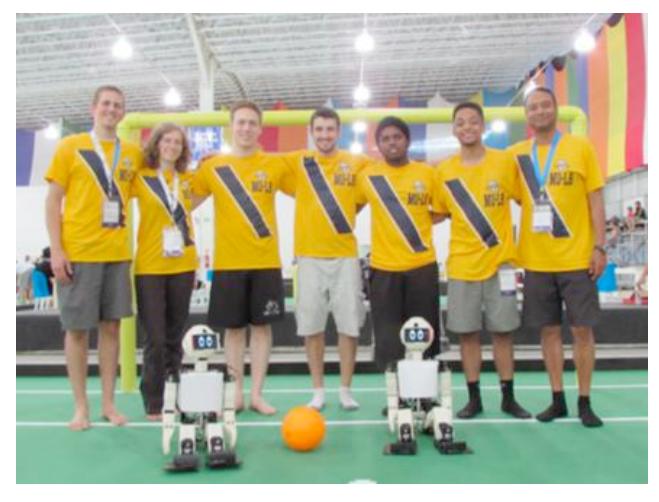 Figure 1 : Team MU-L8 with robots Sonny and Forest at RoboCup 2014 Brazil