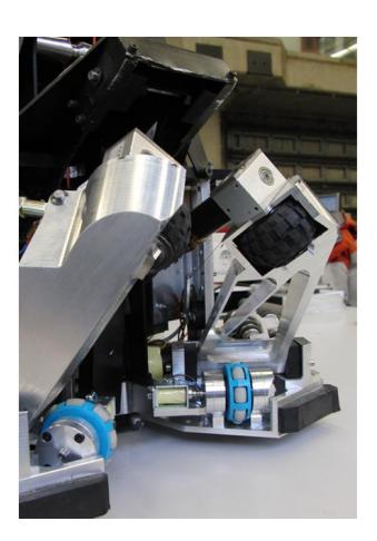 Fifth generation TURTLE with cover attached (left), with cover removed (middle) and a close up of the robustified ball handling mechanism (right).