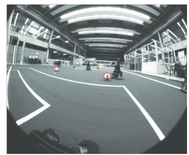 Left: Principle of the ball detection algorithm. For a number of points on a circle with radius r around the pixel the derivative in the direction of the center point is calculated. The sum of these derivatives for radius r gives the confidence measure of a circle with a radius r being present at this pixel. Center: Example image from the front camera. Right: Image of the front camera with ball detection (Note that the blue ball is not detected due to the shape after the gradient operation).