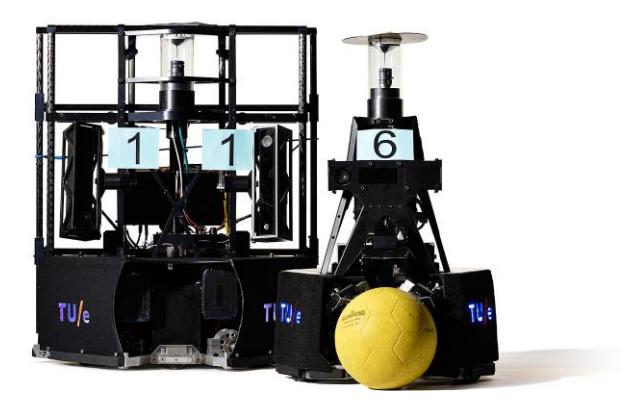 Fig. 1. Fifth generation TURTLE robots, with on the left-handside the goalkeeper robot. (Photo: Bart van Overbeeke)