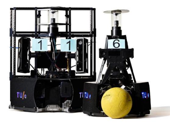Fig. 1. Fifth generation TURTLE robots, with on the left-handside the goalkeeper robot. (Photo: Bart van Overbeeke)