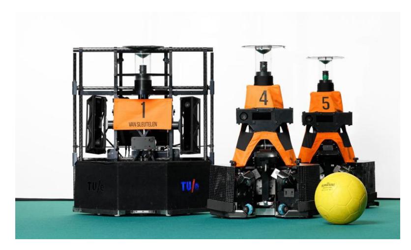 Fig. 1: Fifth generation TURTLE robots, with the goalkeeper on the left-hand side. (Photo by Bart van Overbeeke)