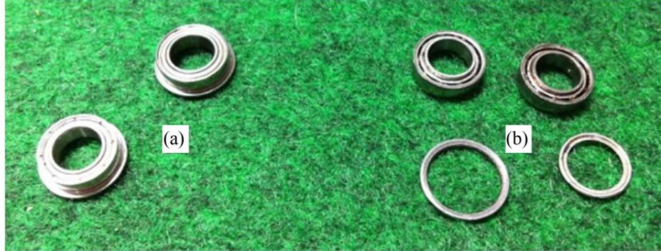 Fig. 2 Bearings used in wheel of 2011 version, (a) normal and (b) broken