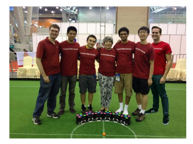 CMDragons 2015 Small Size League team. Humans from left to right: Steven Klee, Richard Wang, Juan Pablo Mendoza, Manuela Veloso, Joydeep Biswas, Danny Zhu, and Philip Cooksey.