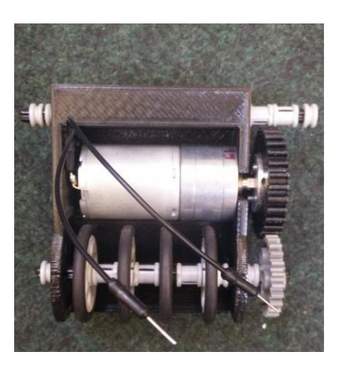Fig. 6: Dribbler frame with motor and Lego roller