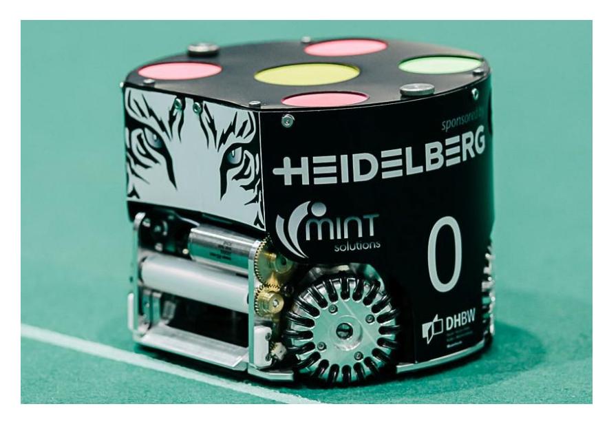 Fig. 2: New robot with cover on the field (v2016). Left and right to the dribbling device the new infrared barrier protection can be seen (white).