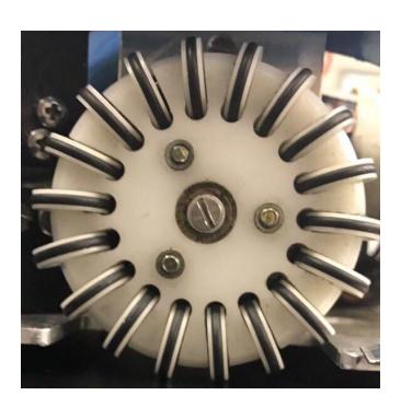 Fig. 7: (a) Old wheel made in plastic (b) Machined aluminum wheel