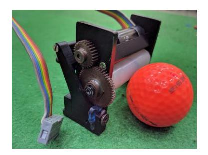 (a) First Prototype of the New Dribbler (b) The latest dribbler for RoboCup 2019
