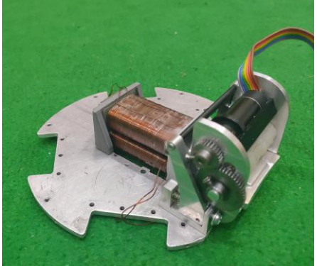 Fig. 2: Side view of the new kicker and dribbler assembly