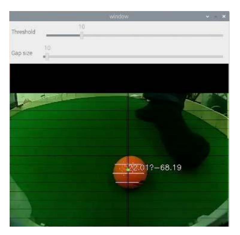 An example of the ball detection. The black lines are the scanning lines and the highlighted parts of them is detected as parts in the contour of the ball. The green point is the estimated ball position