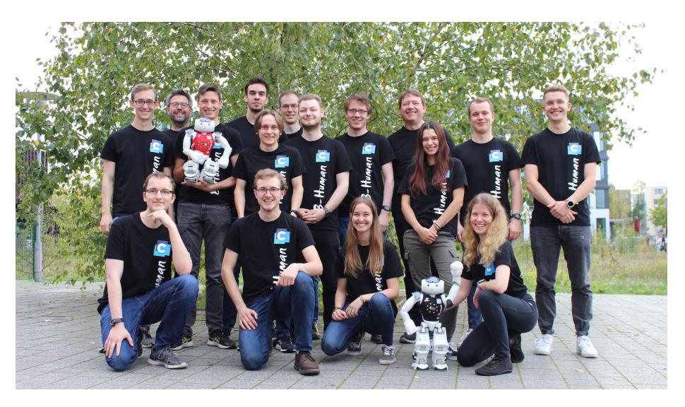 Fig. 1: The majority of the current B-Human team members for the RoboCup 2023 season.