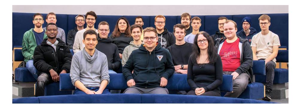 Fig. 1. The majority of the current B-Human team members for the RoboCup 2024 season.